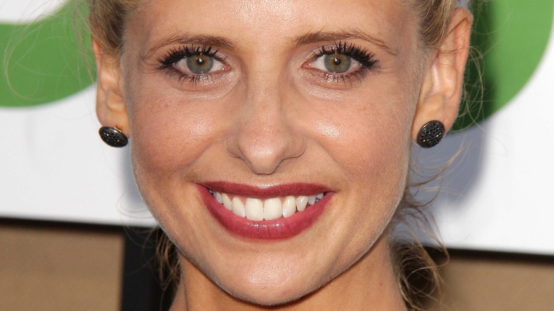 Sarah Michelle Gellar smiles in red lipstick