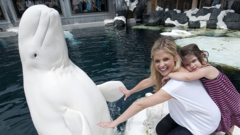 Charlotte hugging her mom at SeaWorld.
