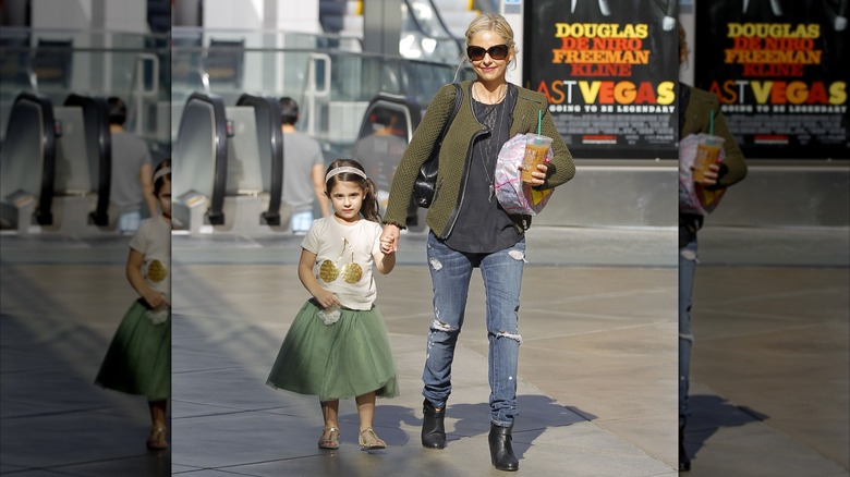 Charlotte Grace Prinze walking with her mom Sarah Michelle Gellar in 2012.