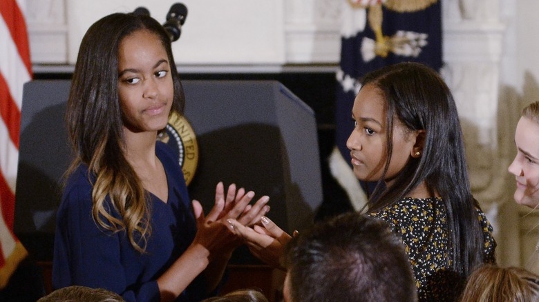 Malia and Sasha Obama having a conversation