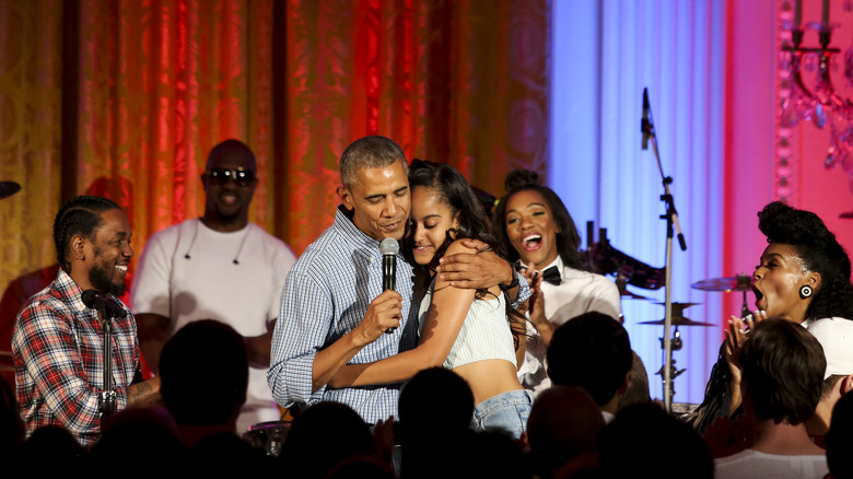 Barack Obama hugging Malia Obama at the 2016 Fourth of July White House party
