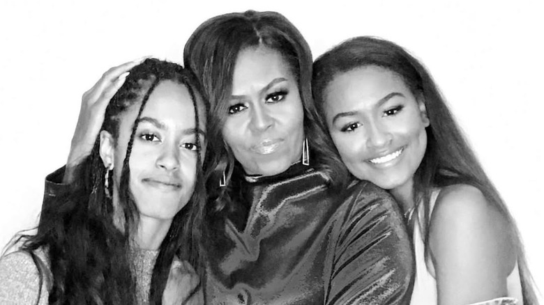 Michelle Obama poses with Malia and Sasha