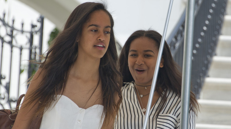 Malia and Sasha Obama outside White House.