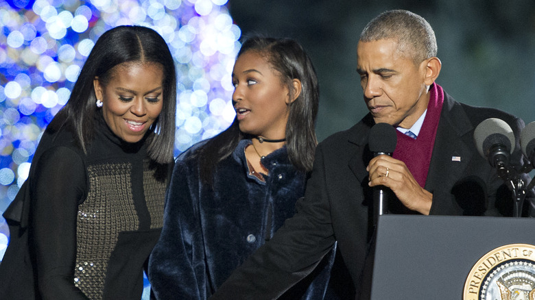 Sasha Obama with her parents