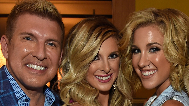 Todd, Lindsie, and Savannah Chrisley posing