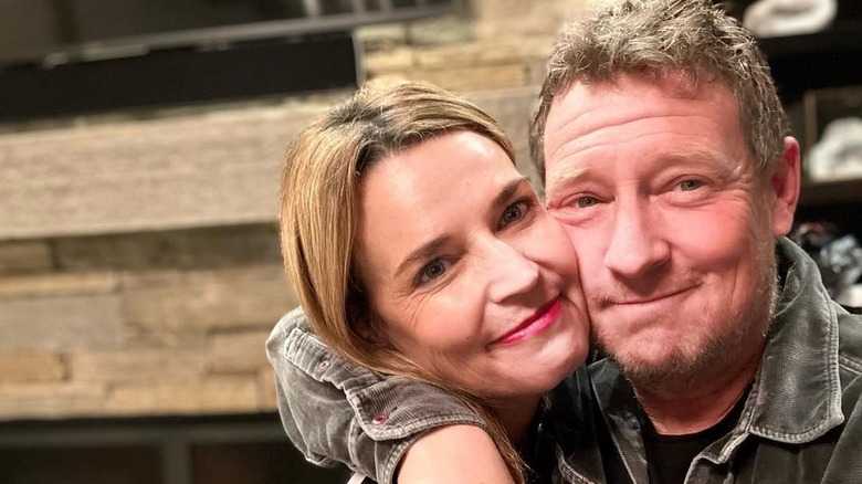 Michael Feldman hugs his wife Savannah Guthrie as they take a selfie
