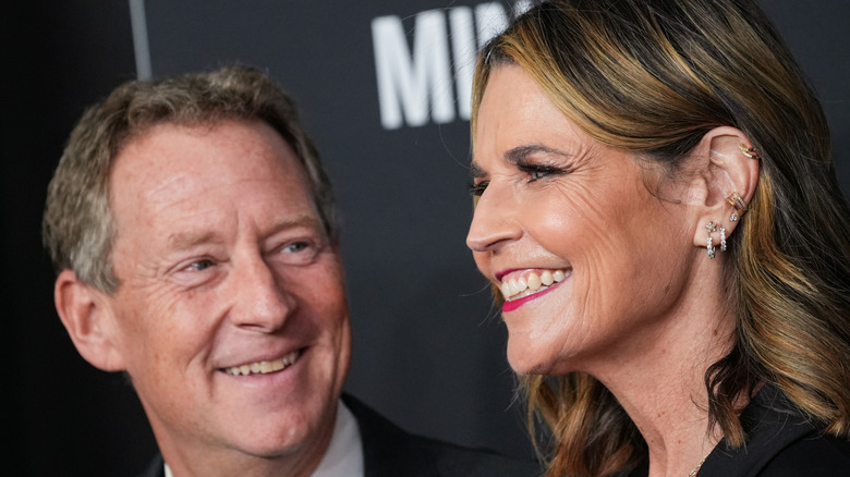 Michael Feldman looking at his wife Savannah Guthrie at a red carpet event
