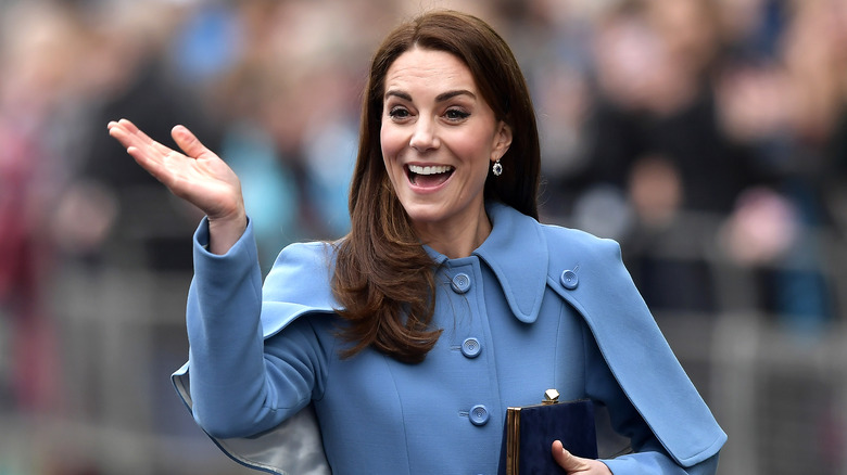 Kate Middleton laughing blue jacket