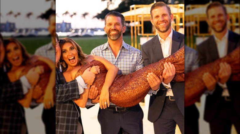 Alina Habba being carried by Don Jr., Eric Trump and a friend.