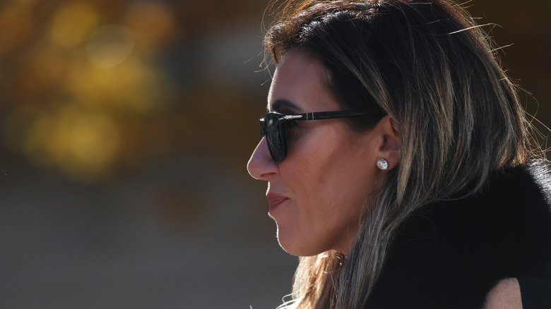 Alina Habba arrives to court in sunglasses.