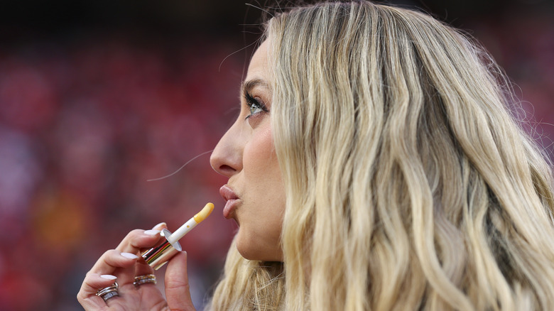 rittany Mahomes applying lip gloss prior to the AFC Championship Game between the Kansas City Chiefs and the Buffalo Bills at GEHA Field at Arrowhead Stadium
