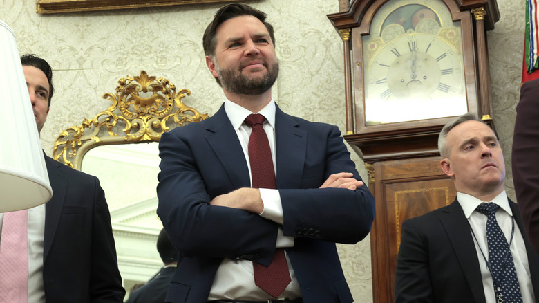 JD Vance in the oval office with his arms crossed