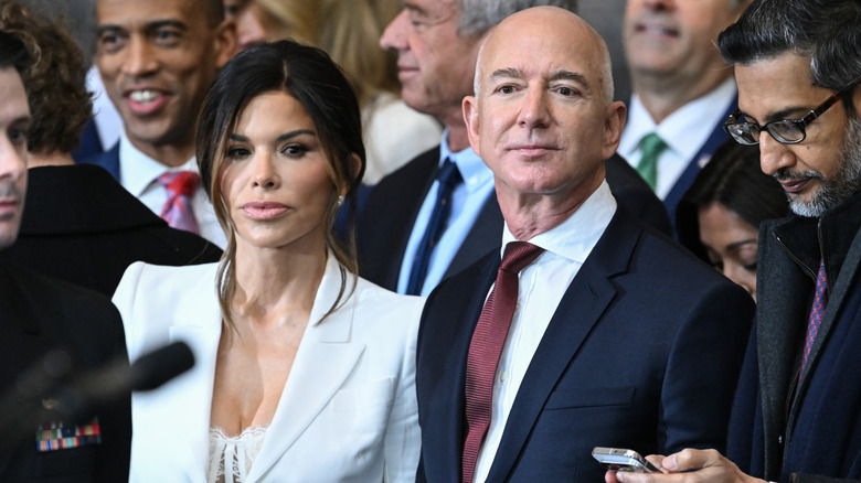 Lauren Sanchez and Jeff Bezos standing at Donald Trump's 2025 inauguration