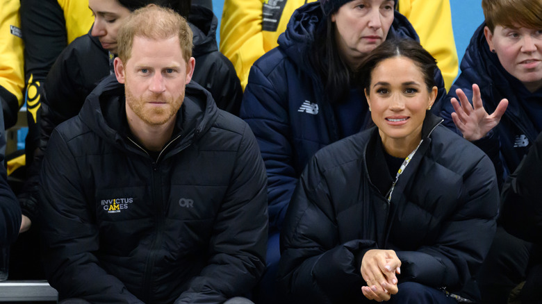 Prince Harry and Meghan Markle sitting together
