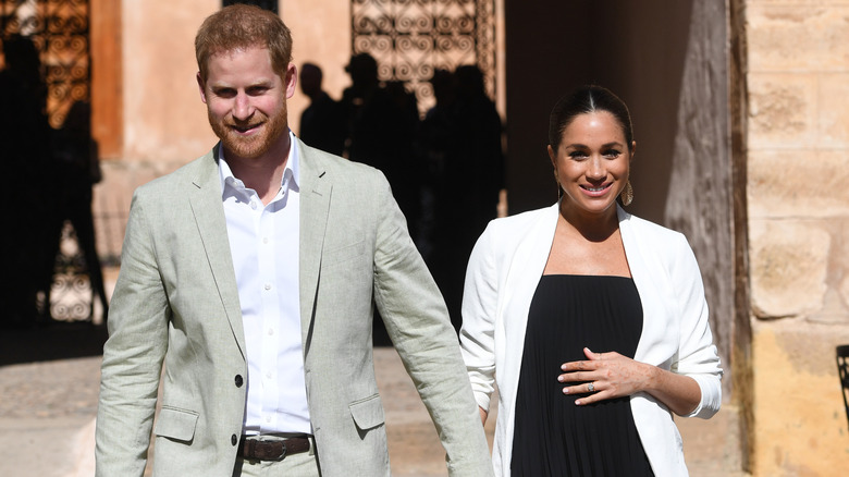 Prince Harry and a pregnant Meghan Markle