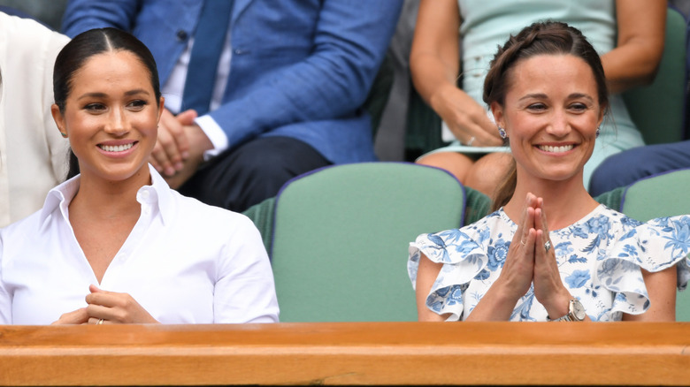 Meghan Markle and Pippa Middleton smile at Wimbledon