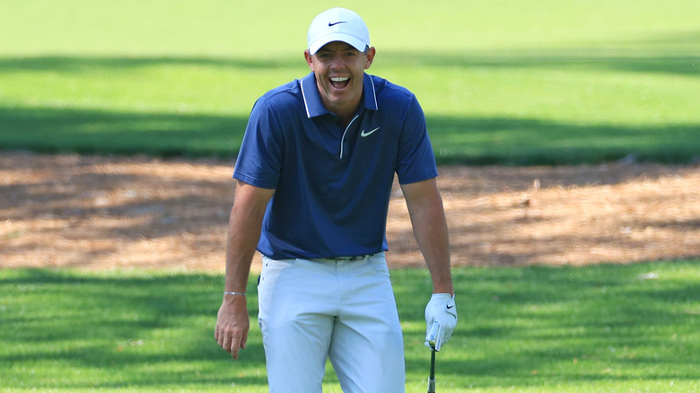 Rory McIlroy laughing on the course at the 2025 Masters.
