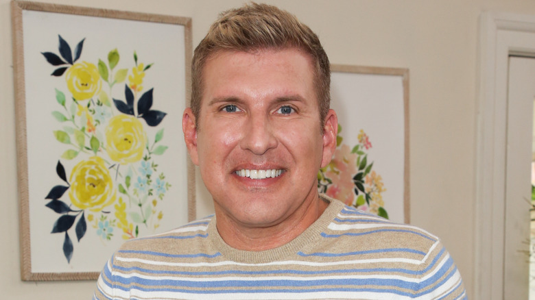 Todd Chrisley smiling at a TV appearance.