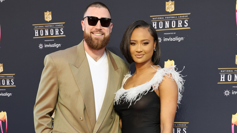Travis Kelce posing with Kayla Nicole