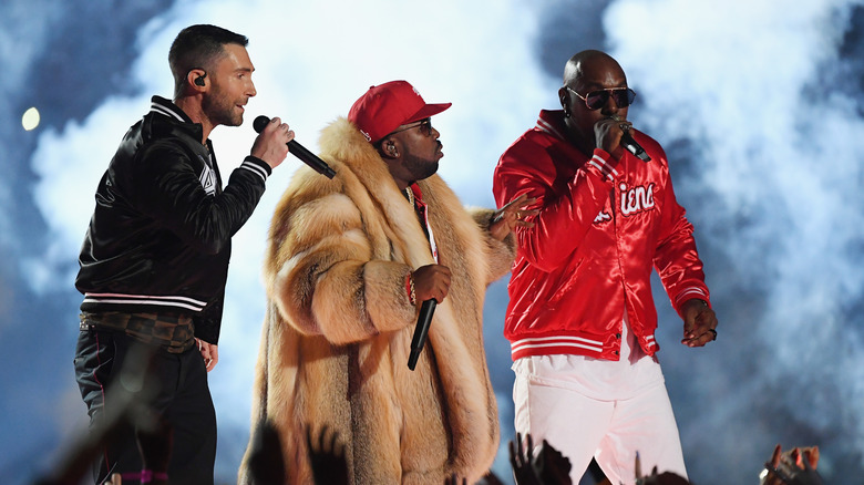 Adam Levine on stage at the Super Bowl with Big Boi and Sleepy Brown
