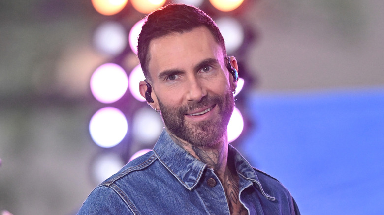 Adam Levin smiling on stage