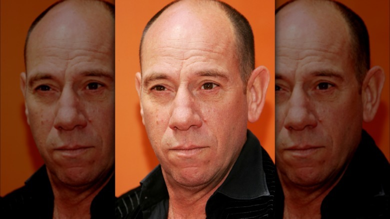 Miguel Ferrer looking at camera