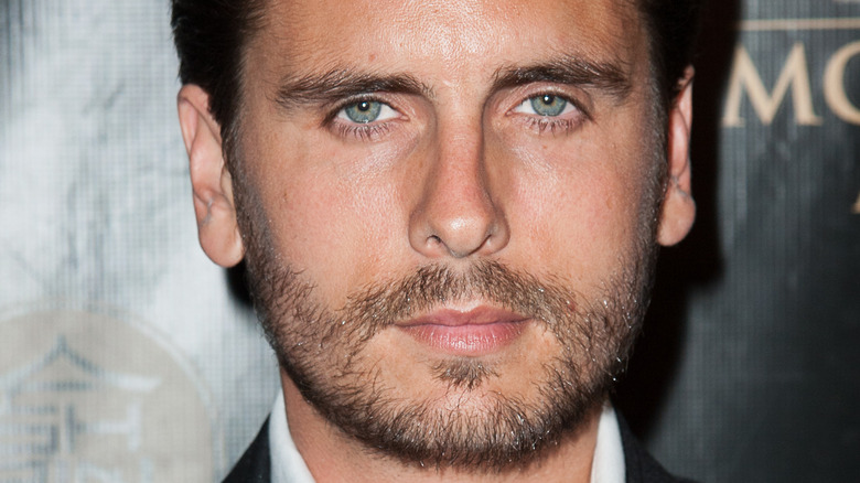 Scott Disick grimaces on the red carpet