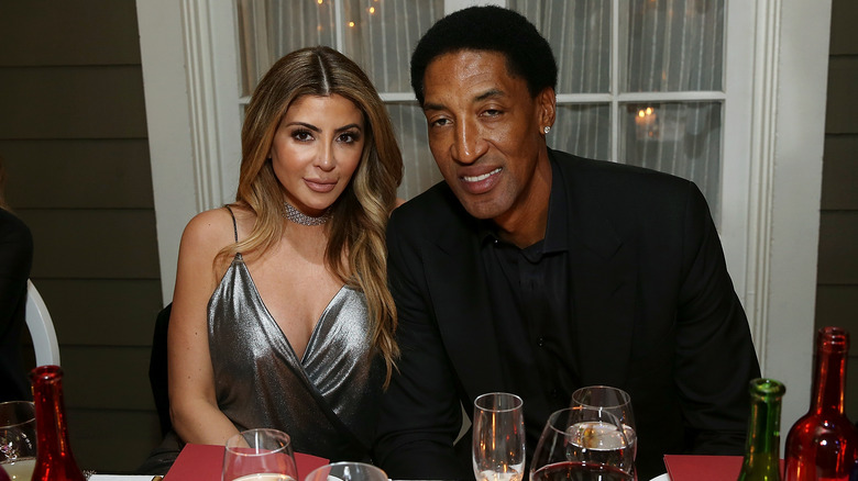 Scottie Pippen and Larsa Pippen sit together at dinner table
