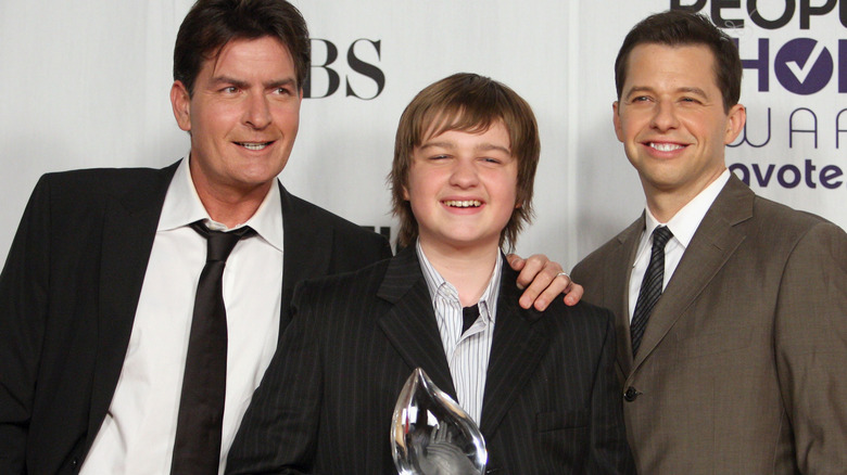 Charlie Sheen, Jon Cryer and Angus T. Jones show off an award