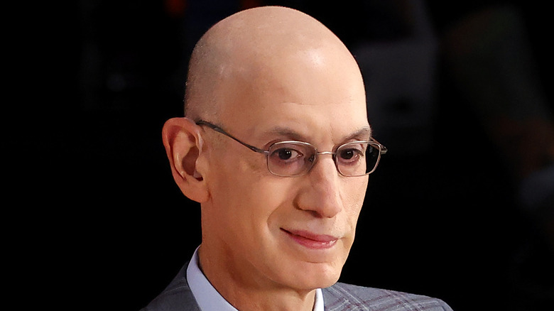 David Silver in front of a microphone