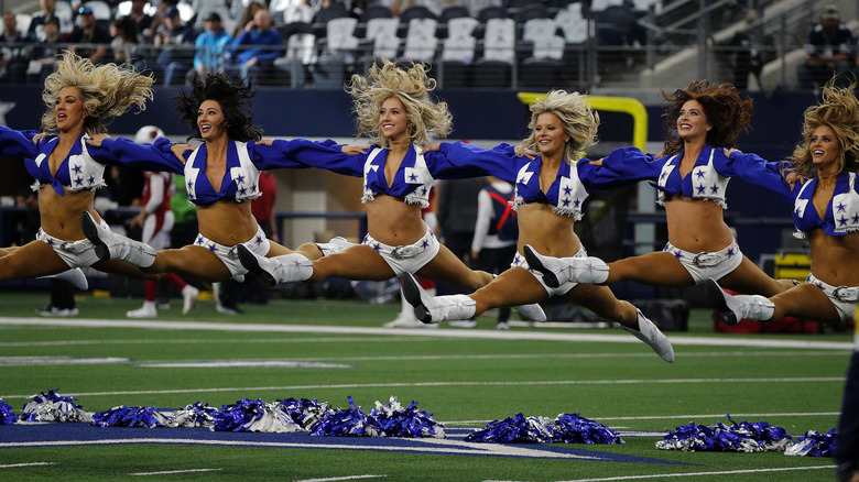 Dallas Cowboy cheerleaders jumping
