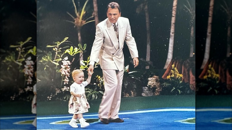 A 1-year-old Maggie and her dad on the Wheel of Fortune set