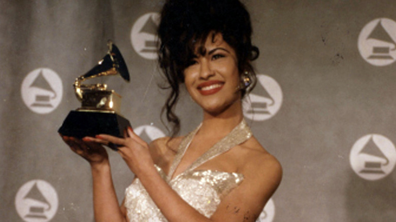 Selena Quintanilla holding a Grammy Award
