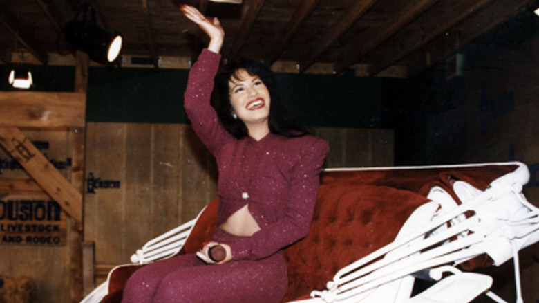 Selena Quintanilla waving horse carriage