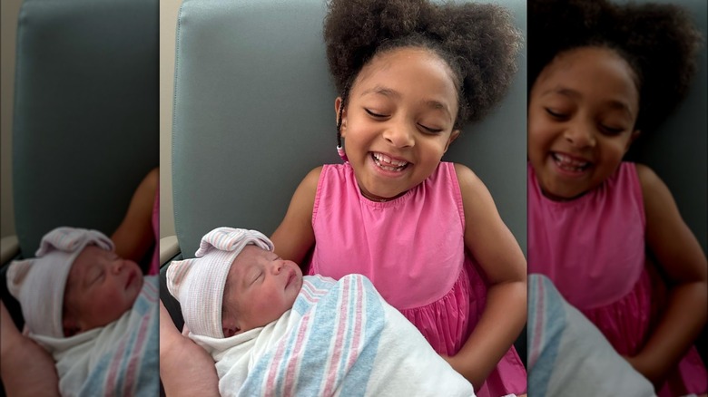 Olympia Ohanian holding her sister Adira