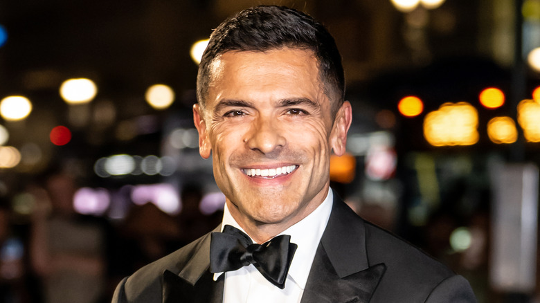 Mark Consuelos posing for cameras in a tuxedo