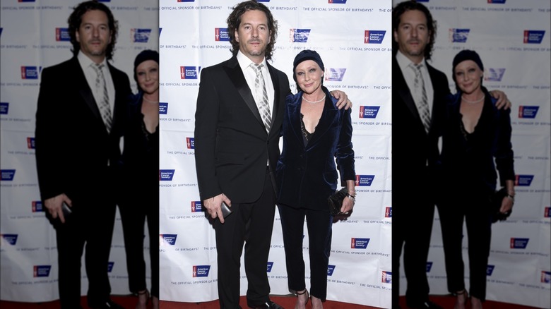 Kurt Iswarienko with hand on Shannen Doherty's shoulder