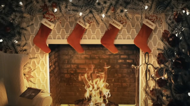 Fireplace mantel with stockings for Mom, River, Remy, and Nope