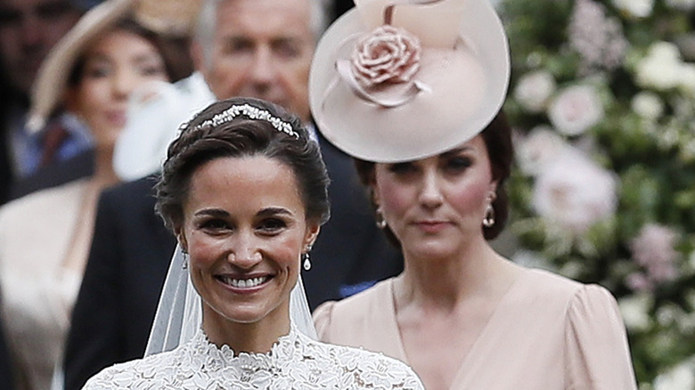 Kate Middleton walks behind Pippa at her wedding