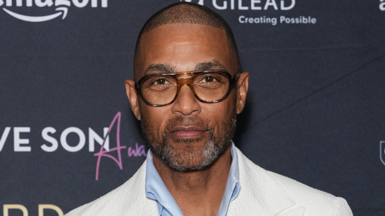 Don Lemon posing in white suit