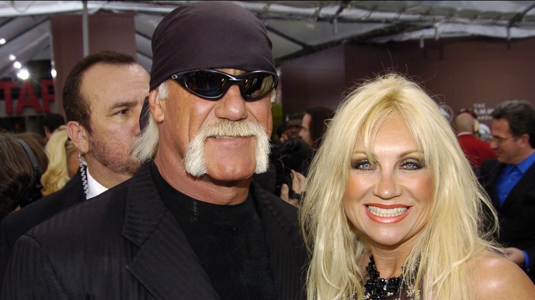 Hulk Hogan and Linda Hogan smile beside each other at the Grammys