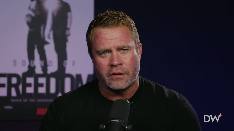 Tim Ballard wears black t-shirt