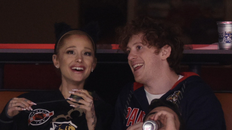 Ariana Grande and Ethan Slater looking on prior to Game One of the 2024 Stanley Cup Final between the Florida Panthers and the Edmonton Oilers at Amerant Bank Arena