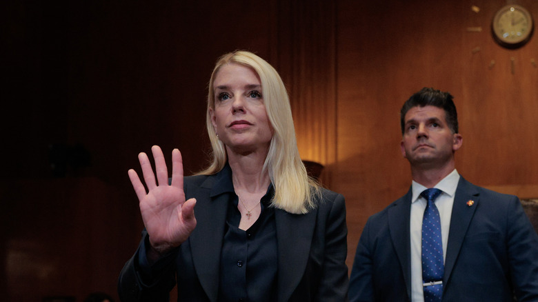 Pam Bondi holds up her hand for sworn testimony