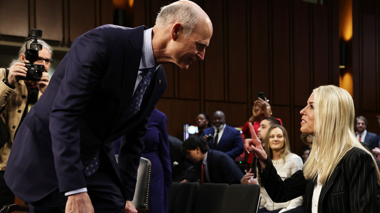 Rick Scott bending to speak with Pam Bondi