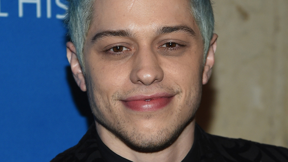 Pete Davidson with blue-green hair 