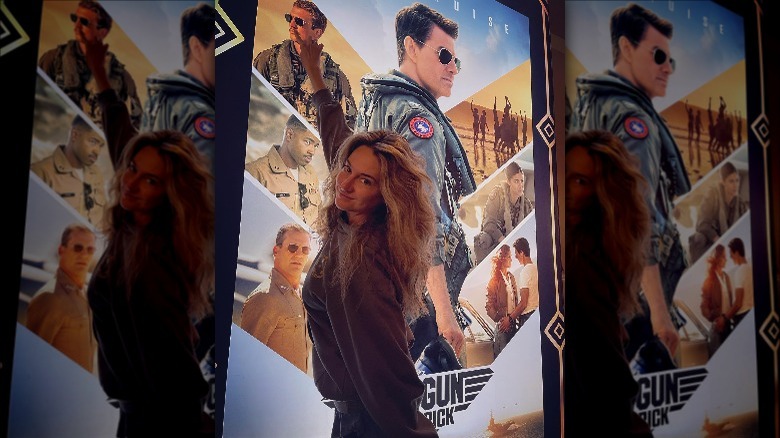 Shailene Woodley in front of Top Gun poster