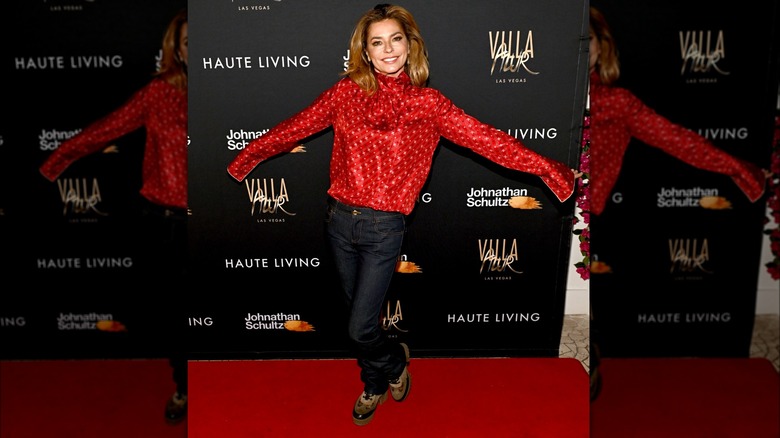 Haute Living wearing red