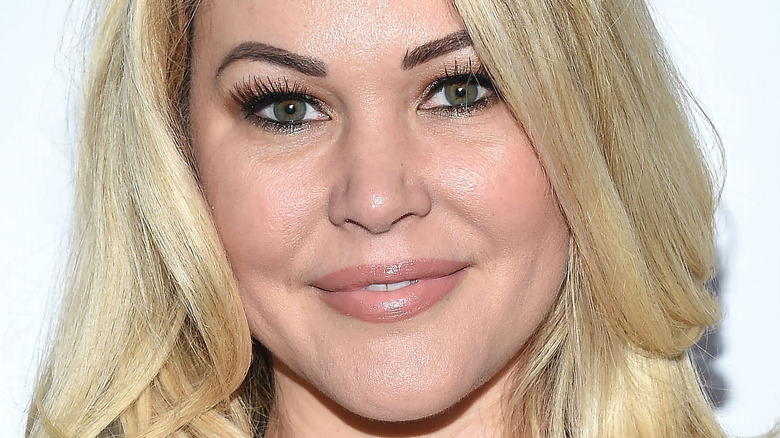 Shanna Moakler smiles with hair down