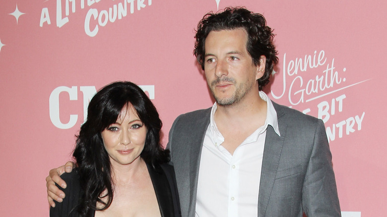 Shannen Doherty and Kurt Iswarienko posing